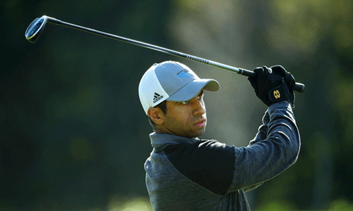 Aaron Rai holds in Storm Alex wearing Macwets during Scottish Open win