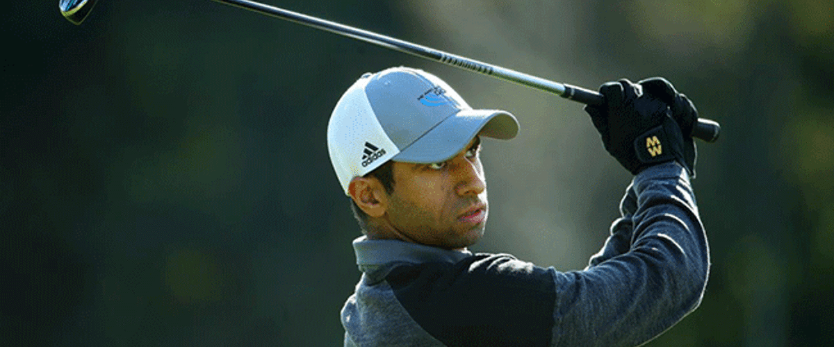 Aaron Rai holds in Storm Alex wearing Macwets during Scottish Open win